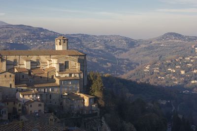 High angle view of townscape and mountains against sky