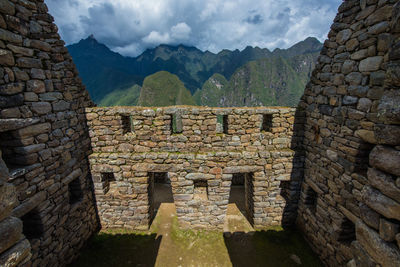 Stone wall against mountains