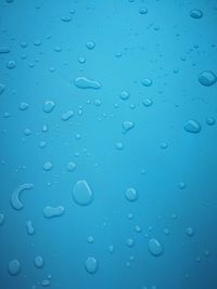 Full frame shot of raindrops on window