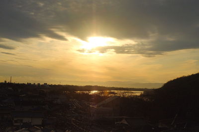 Scenic view of buildings against sky during sunset