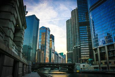 Low angle view of skyscrapers against sky in city