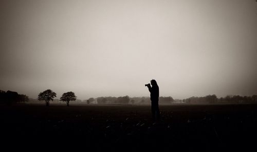 People standing on grassy field