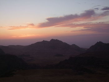 Scenic view of mountains against dramatic sky