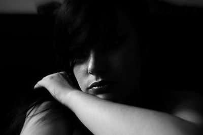 Close-up portrait of a serious young woman