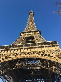 Low angle view of tower against blue sky