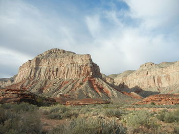 Rock formations on landscape against sky