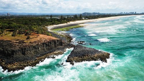 Scenic view of sea shore against sky