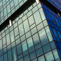 Full frame shot of modern glass building in city