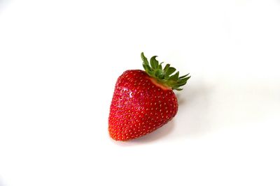 Close-up of strawberry over white background