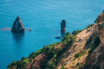 High angle view of rock formations in sea