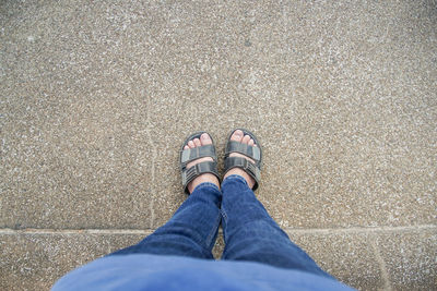 Low section of woman standing on floor