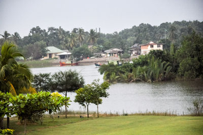 View of lake with houses in background