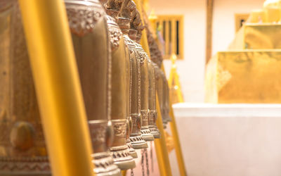 Close-up of yellow machine in building