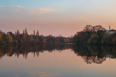 Scenic view of lake against sky during sunset