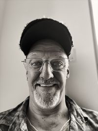 Close-up portrait of man wearing eyeglasses