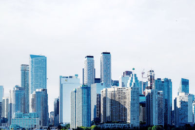 Modern buildings in city against sky