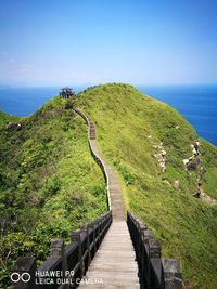 High angle view of calm sea against blue sky