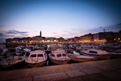 Boats moored at harbor