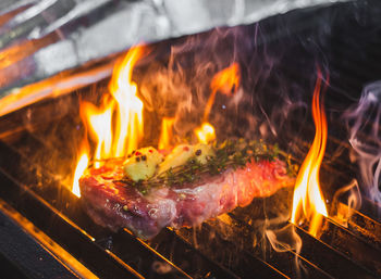 Close-up of steak on barbecue grill