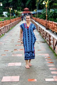 Portrait of smiling woman standing outdoors