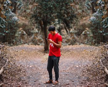 Full length of young man standing on land