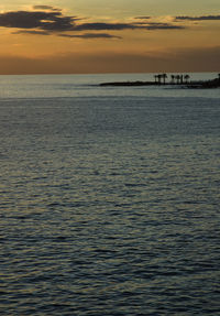 Scenic view of sea at sunset