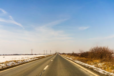 Empty road against sky