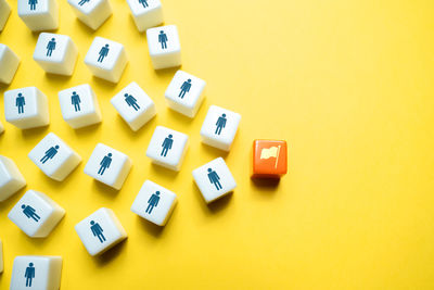 Close-up of dices on yellow background