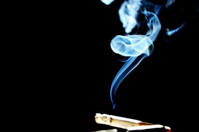 Close-up of smoke against black background