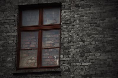 Window on brick wall of house