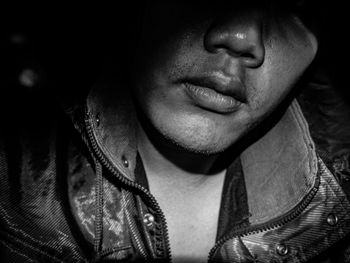 Close-up of man face in darkroom