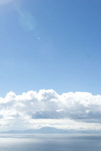 Low angle view of sea against blue sky