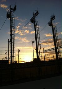 Low angle view of electricity pylon against sky