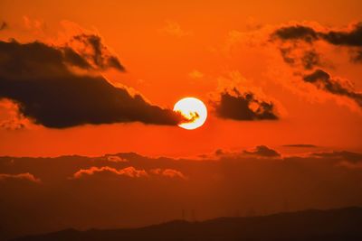 Scenic view of silhouette landscape against romantic sky at sunset