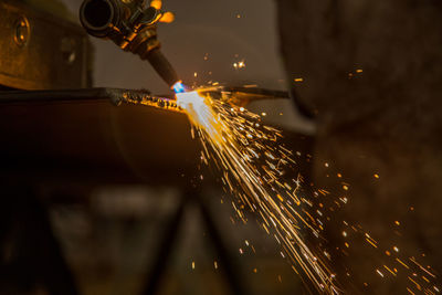 Machine welding metal at workshop