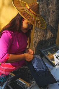 High angle view of woman holding umbrella