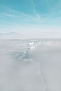 Huge crack in the surface of the frozen lake orestiada in kastoria , greece