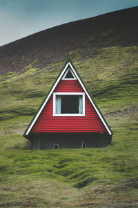 Low angle view of red house on mountain