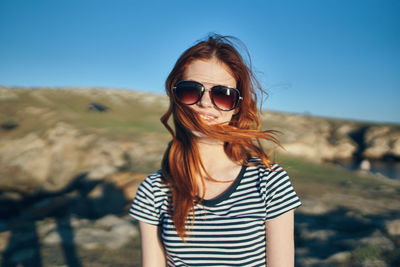 Portrait of young woman wearing sunglasses