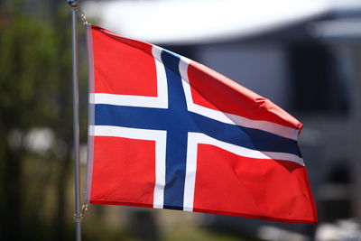 Low angle view of flag against sky