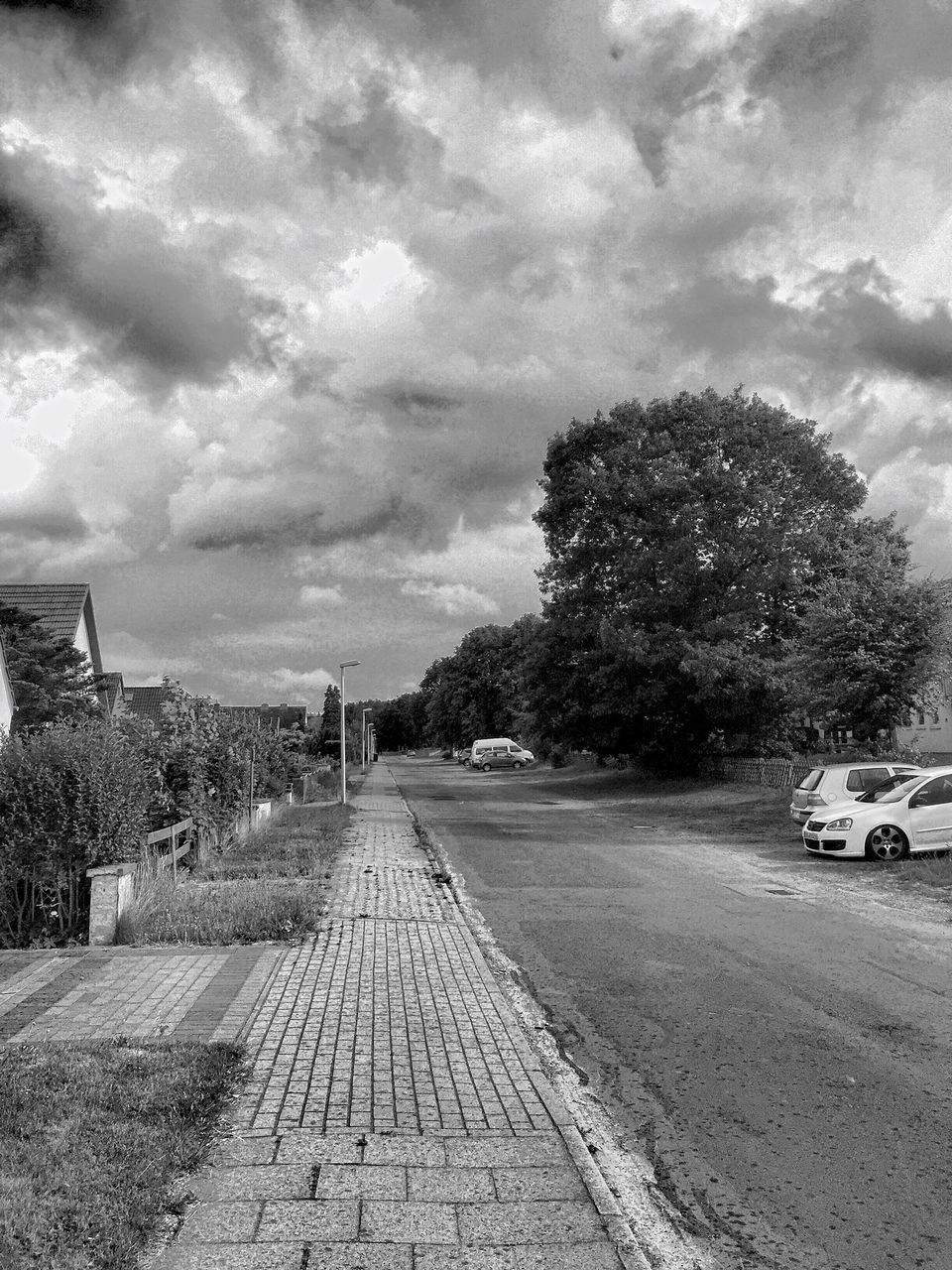 the way forward, sky, transportation, road, cloud - sky, diminishing perspective, vanishing point, cloudy, tree, cloud, street, empty, car, country road, land vehicle, dirt road, road marking, nature, empty road, tranquility