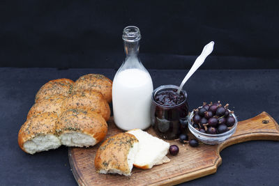 Breakfast on table against black background