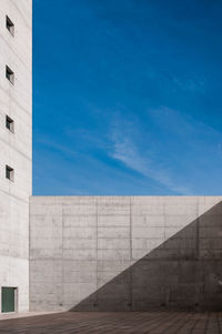Low angle view of building against cloudy sky