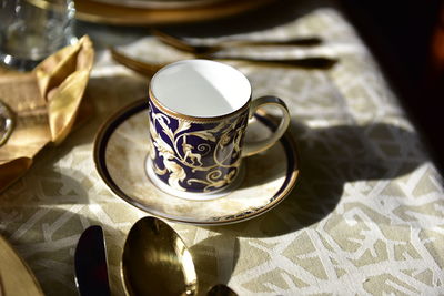 High angle view of coffee cup on table