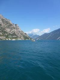 Scenic view of mountains against blue sky