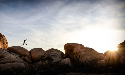 Low angle view of rock formations against sky