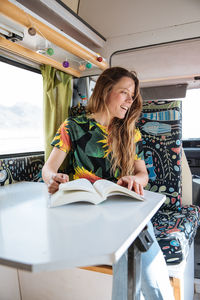 Woman traveling in camper van