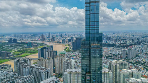 High angle view of buildings in city against sky