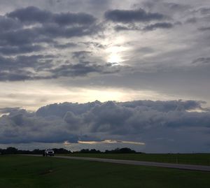 Scenic view of field against sky during sunset