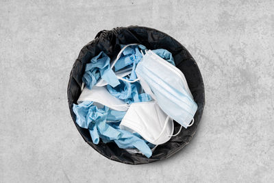 High angle view of garbage can against white background